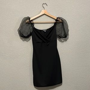 Black dress with puffed sleeves. Never worn with tags!